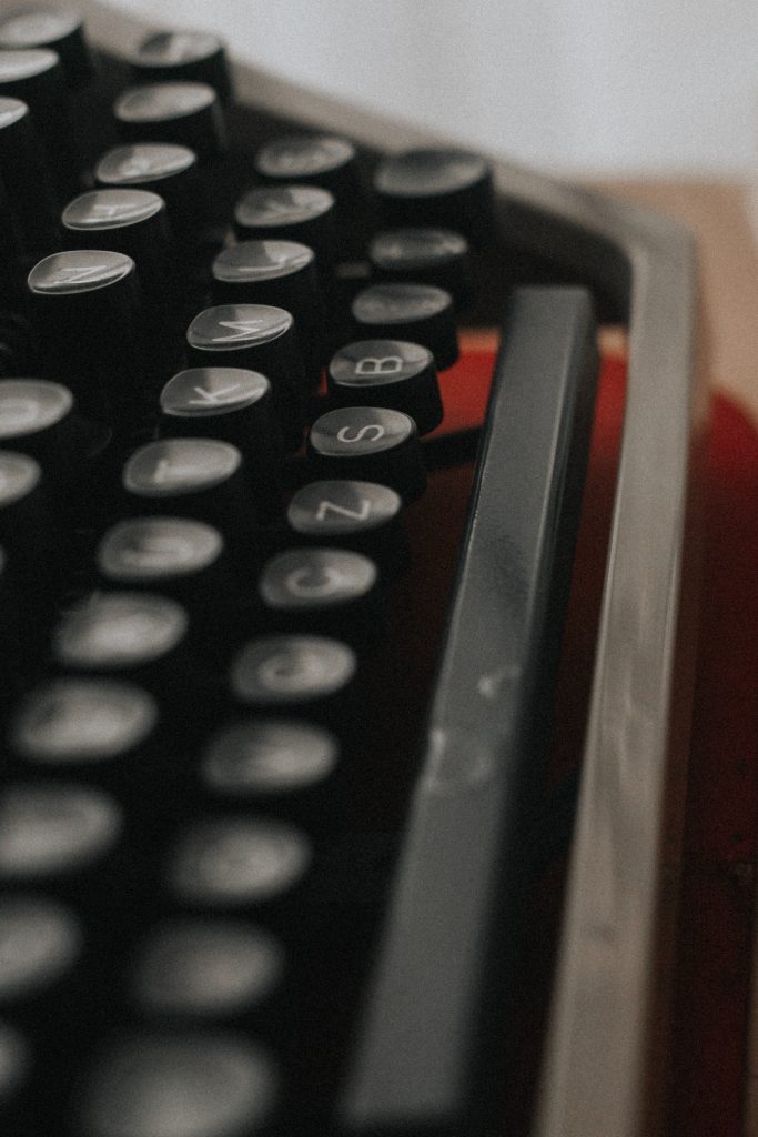Vintage printing press beside modern keyboard with cancelled speech bubble, representing the shift from traditional media freedom to contemporary challenges of cancel culture.